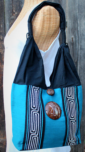 Handmade Cotton shoulder bag with hand embroidered design and hand-craved coconut shell accent